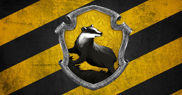 Smiling student sorted into Hufflepuff House at Hogwarts School